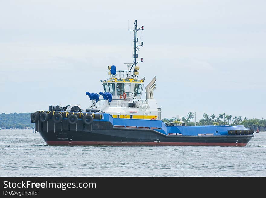 Blue and yellow tugboat 2