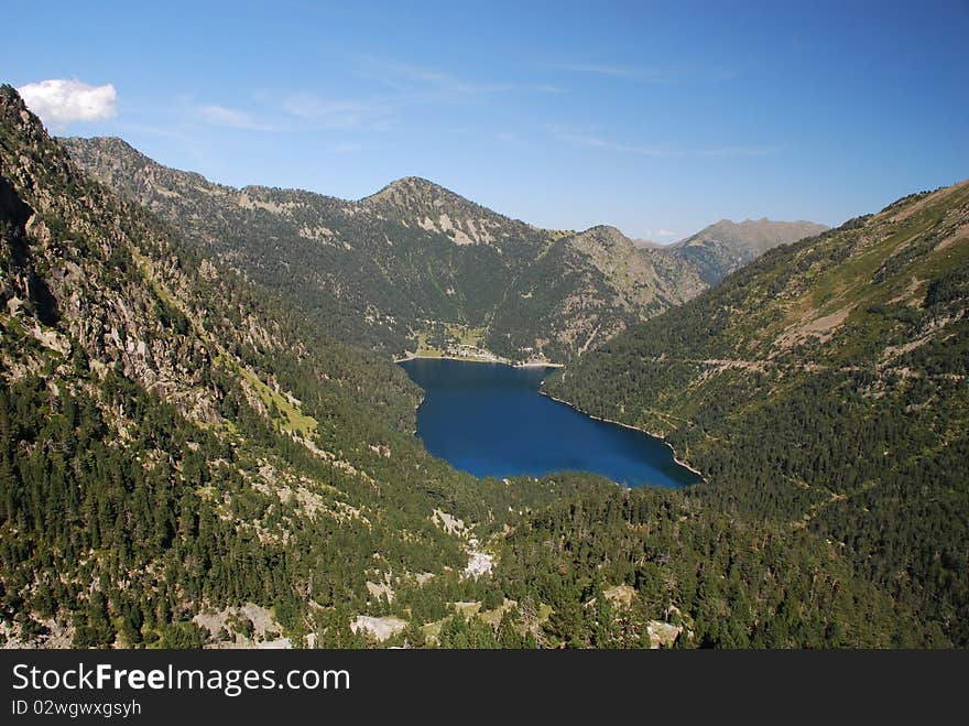 The oredon Lake seen from Cap-de-Long in French Hautes-Pyrenees is in the chain of hydroelectric energy stations. the lake has also a dum seen at the and of the lake surrounded mountains of pyrenees nation park. The oredon Lake seen from Cap-de-Long in French Hautes-Pyrenees is in the chain of hydroelectric energy stations. the lake has also a dum seen at the and of the lake surrounded mountains of pyrenees nation park