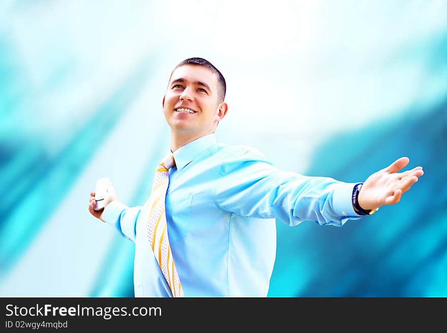 Hapiness Businessman standing on the business background