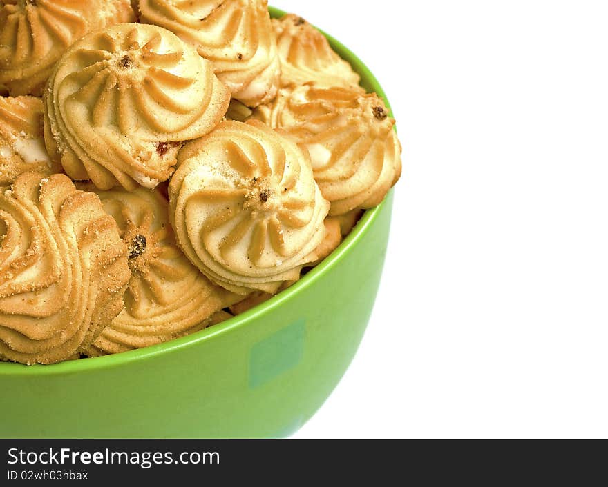 Bowl with cookies isolated over white