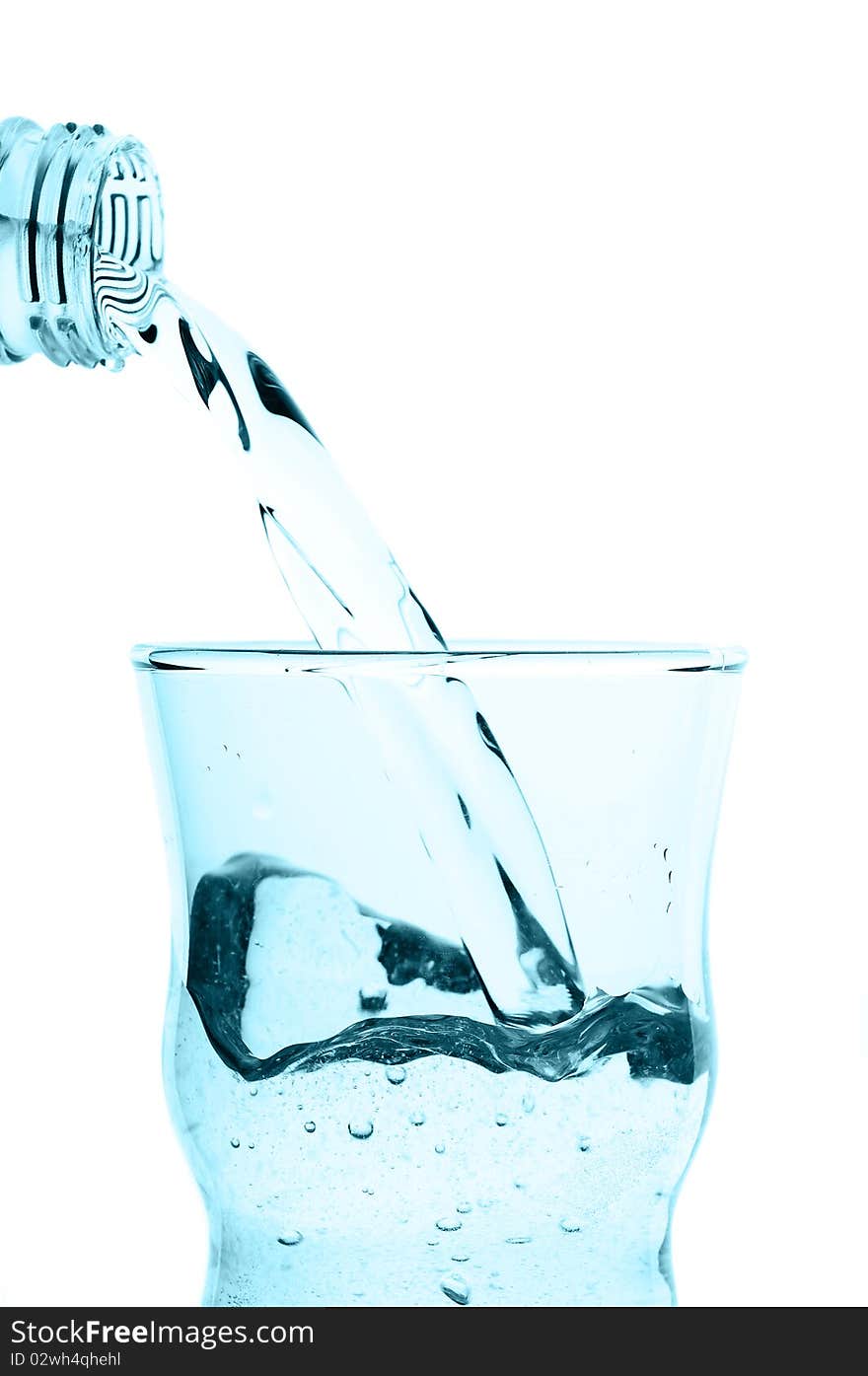 Water pouring into glass isolated on white