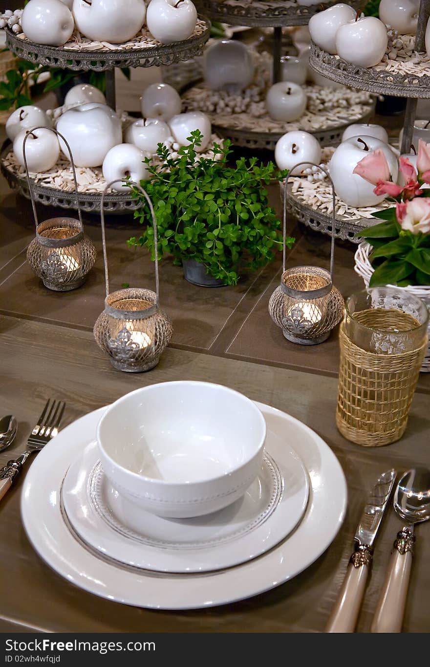 Seasonal table decorated candles and apples