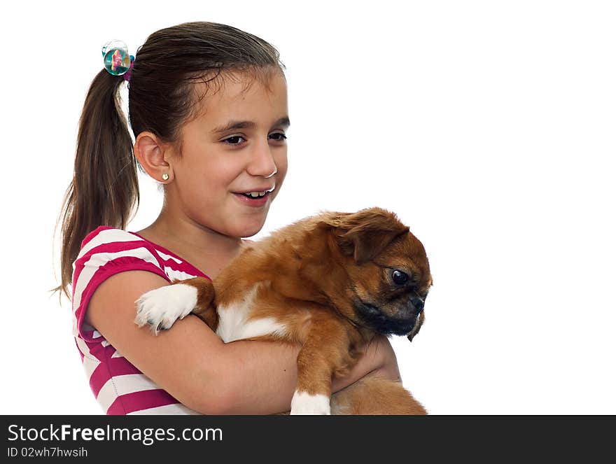 Beautiful girl holding a small pekingese dog on a white background