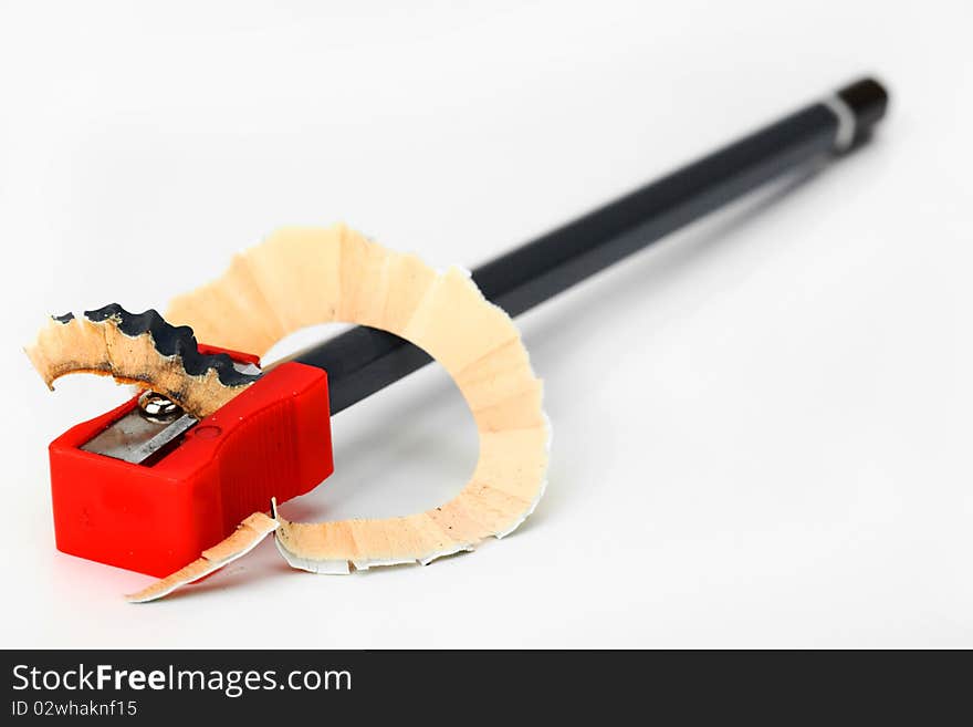 Pencils and pencil sharpener on a white background. Pencils and pencil sharpener on a white background