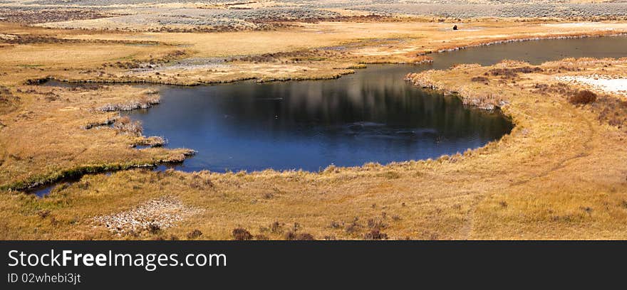 Panoramic view of hot spring pond in yellowstone national park