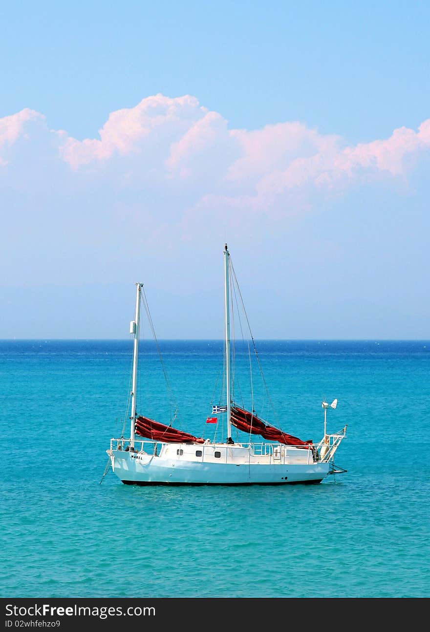 Ship on the sea with clouds at sky