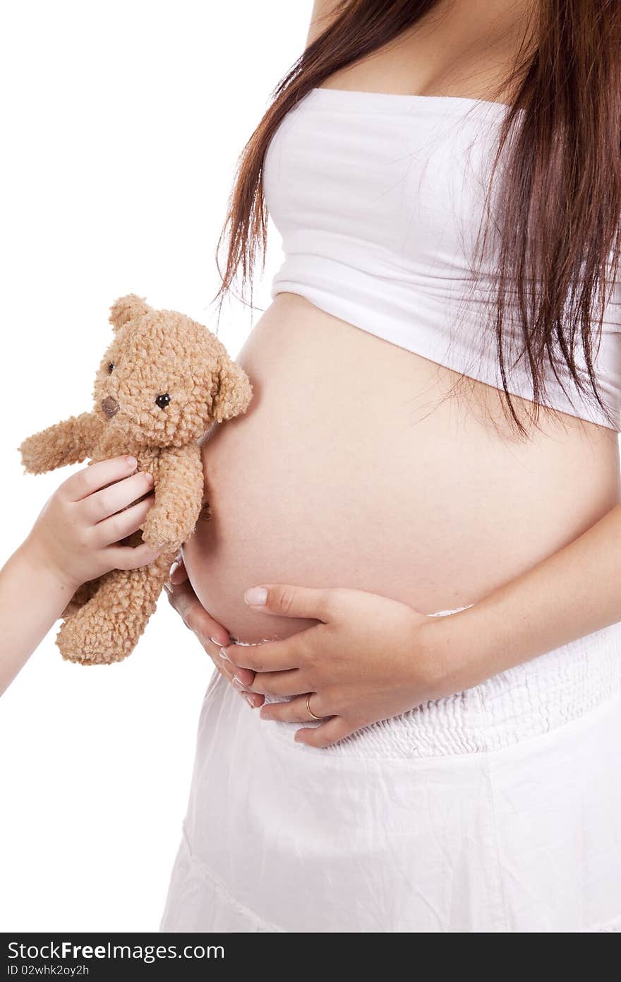 Pregnant mom with child holding bear