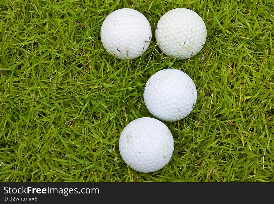 Golf on green field