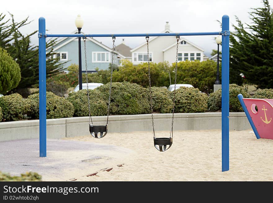 Swing on the children's playground on overcast day. Swing on the children's playground on overcast day