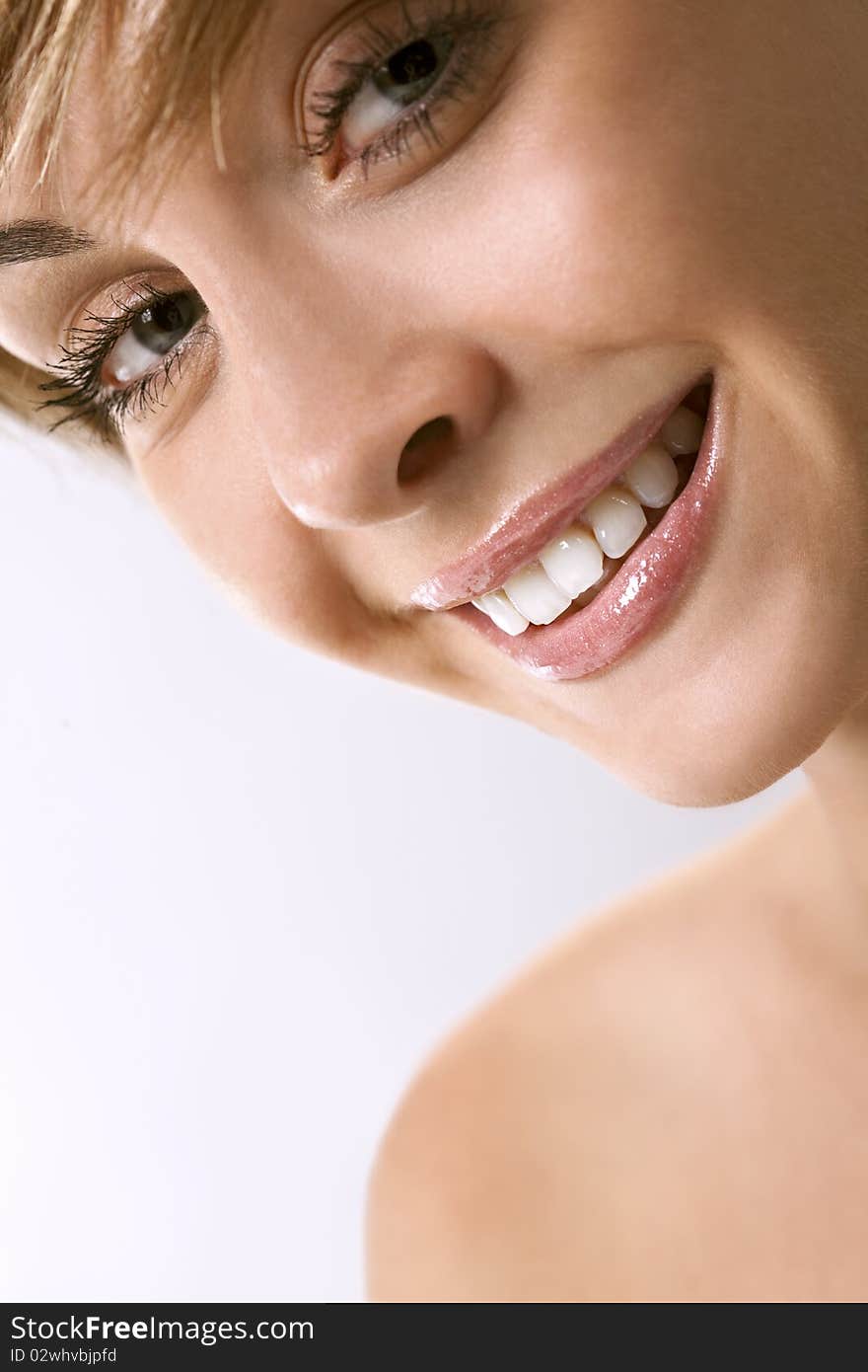 Portrait of beautiful smiling woman isolated over a white background