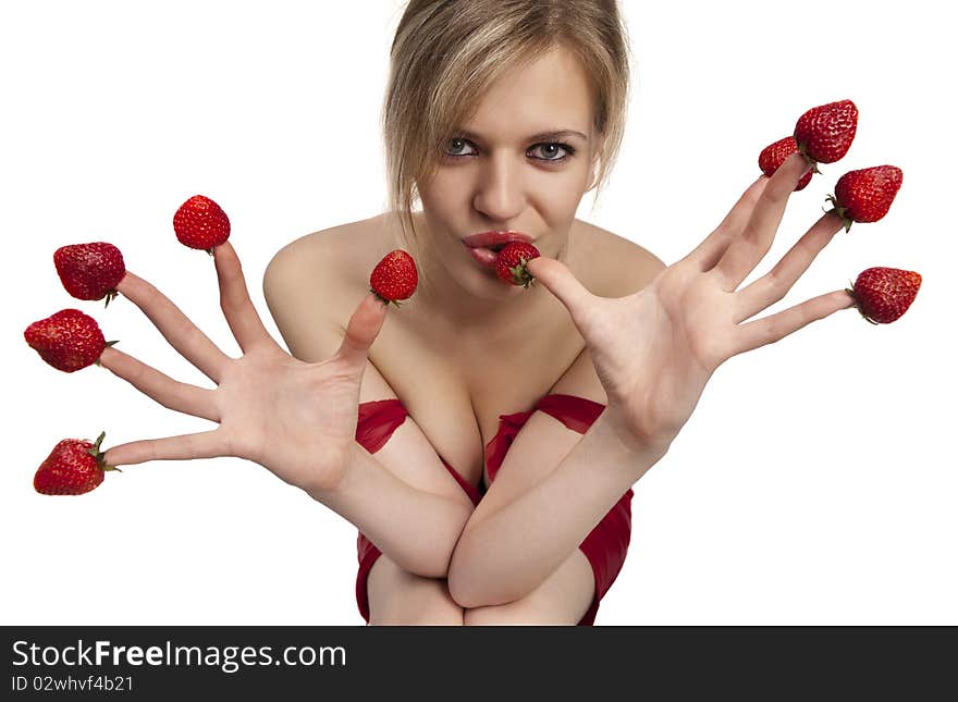 young woman with red strawberries picked on fingertips isolated on white background