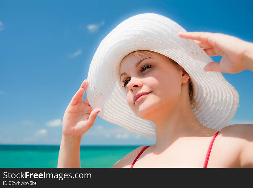 Beautiful girl with white lady's hat. Beautiful girl with white lady's hat