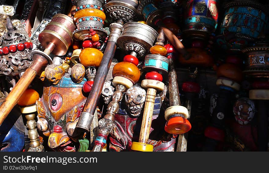 Tibetan prayer wheels and jewelry at a market in Lhasa,Tibet. Tibetan prayer wheels and jewelry at a market in Lhasa,Tibet.