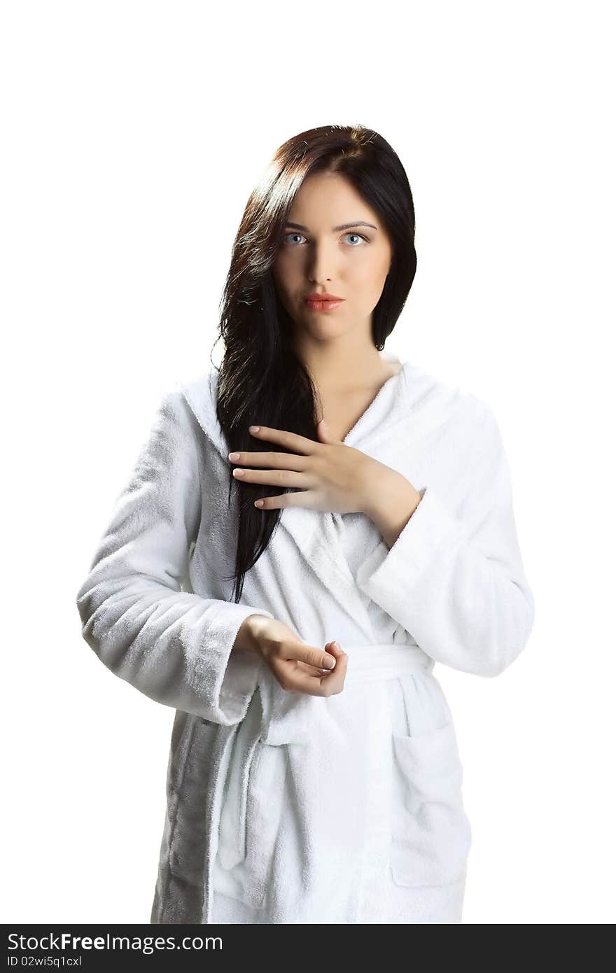 Beautiful woman in bathrobe over white background