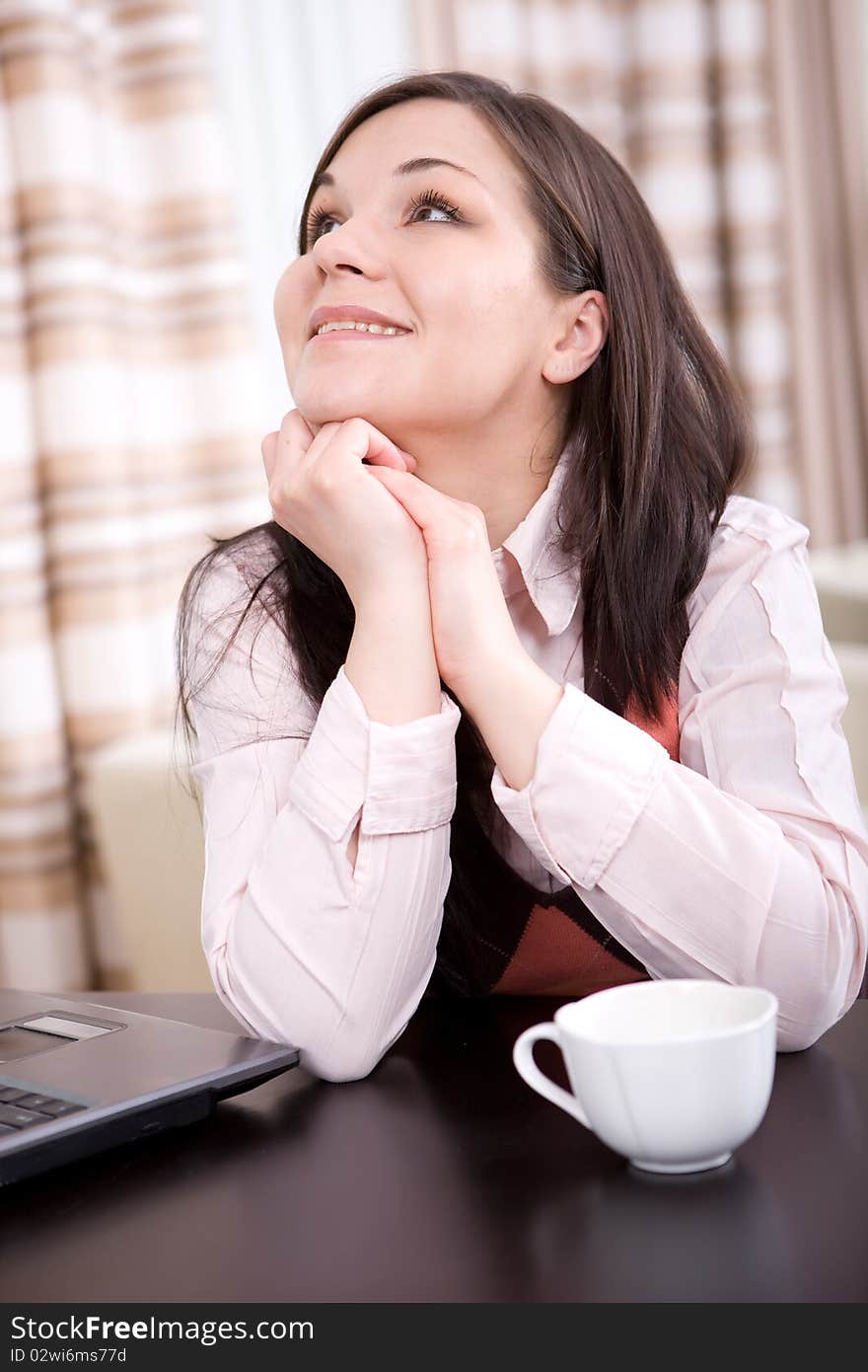 Young adult brunette woman with laptop. Young adult brunette woman with laptop