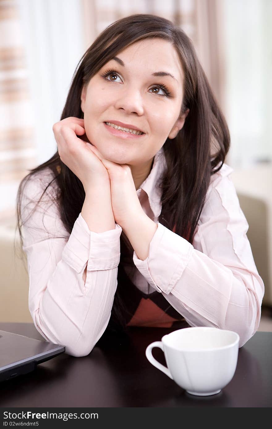 Young adult brunette woman with laptop. Young adult brunette woman with laptop