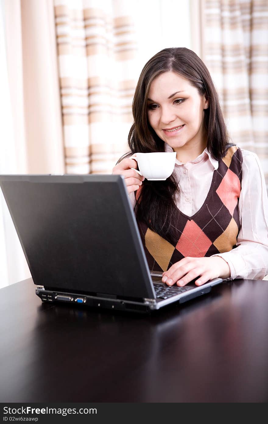 Young adult brunette woman with laptop. Young adult brunette woman with laptop