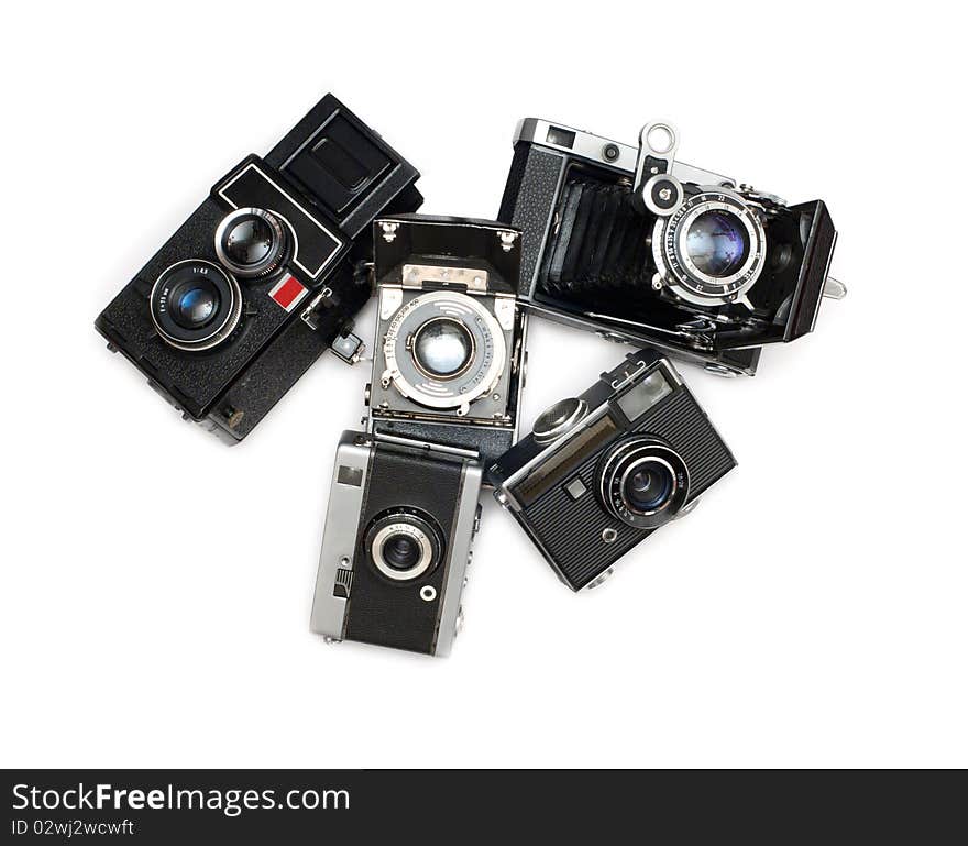 Many ancient cameras on white background