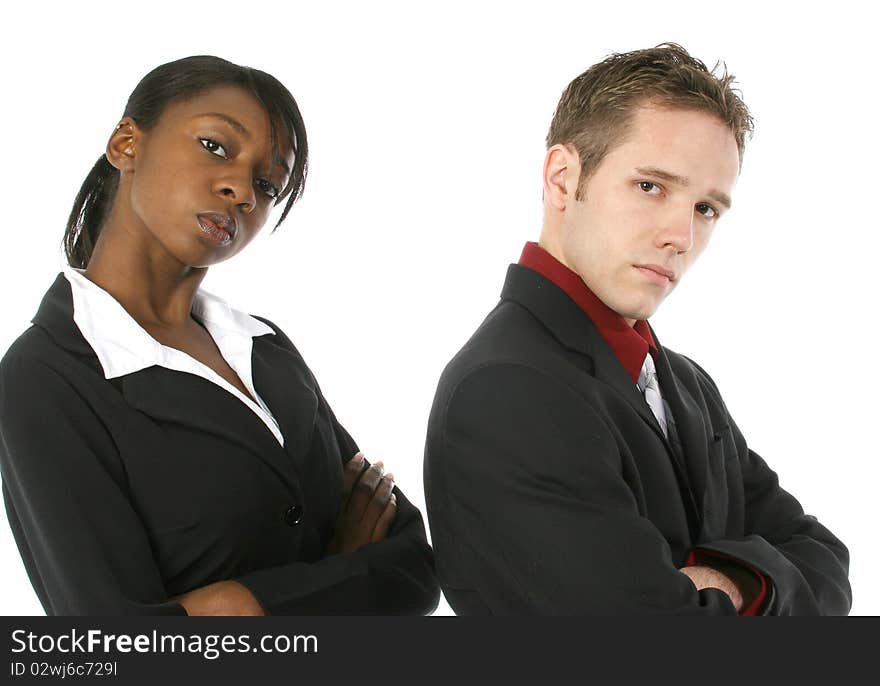 Attractive young business team with serious expressions over white background. Male and female.