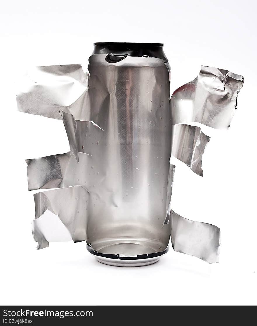 Torn aluminum can on white