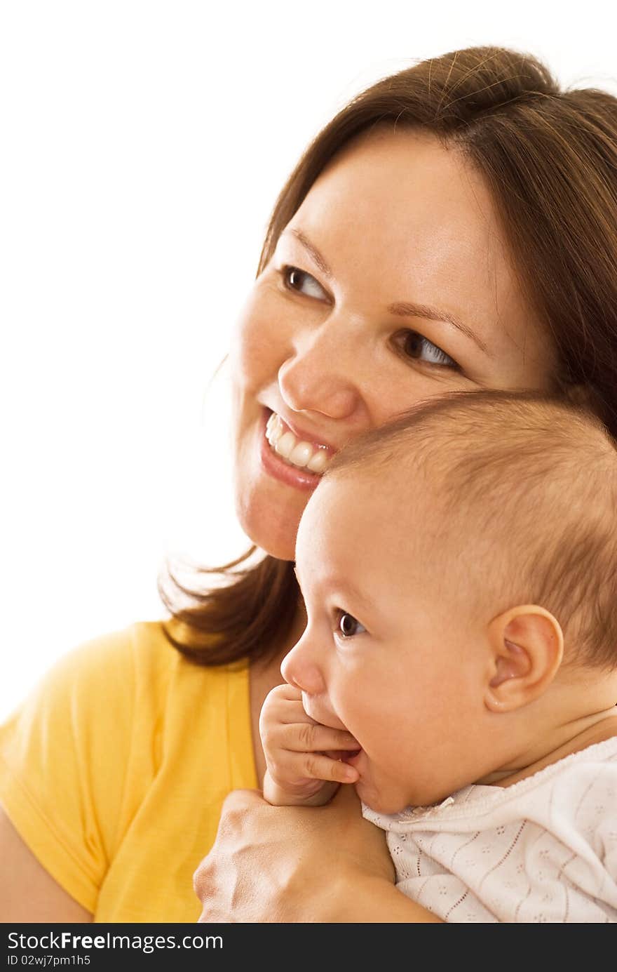 Happy mother stands and holds the baby