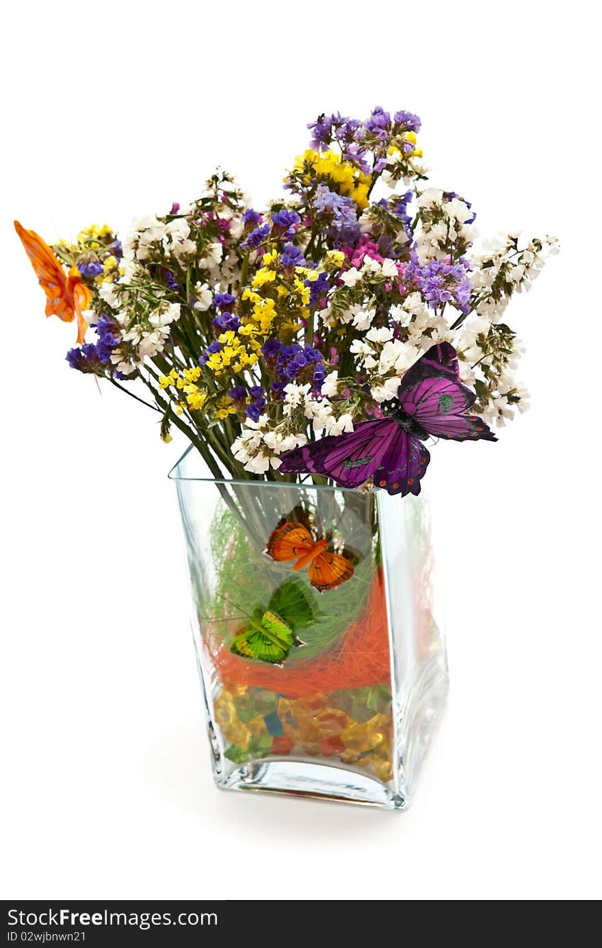 Flowers in glass vase with butterflies. Isolated on white. Flowers in glass vase with butterflies. Isolated on white