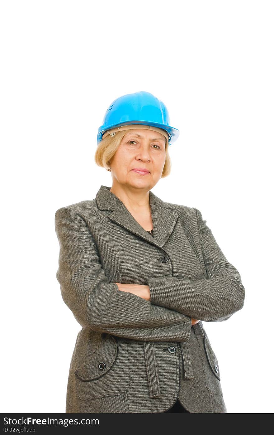 Portrait of a senior engineer woman with blue hard hat standing confidently isolated on white background