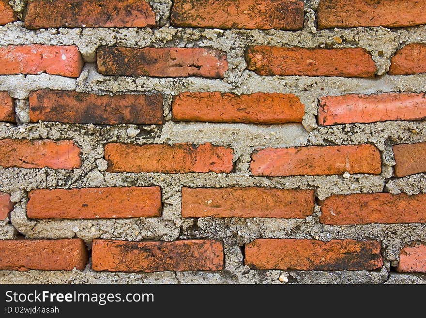 The old brick wall in Thai temple.