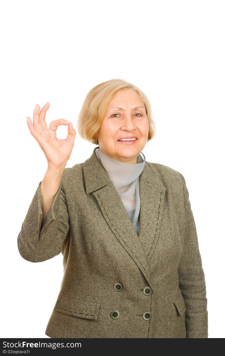 Smiling senior business woman showing okay symbol