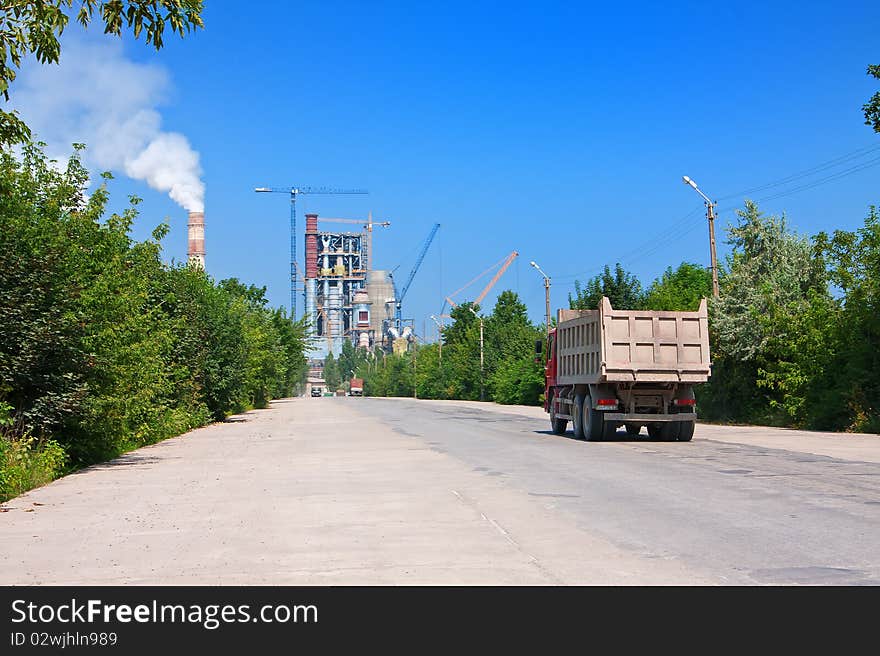 Trucks on road to cement plant