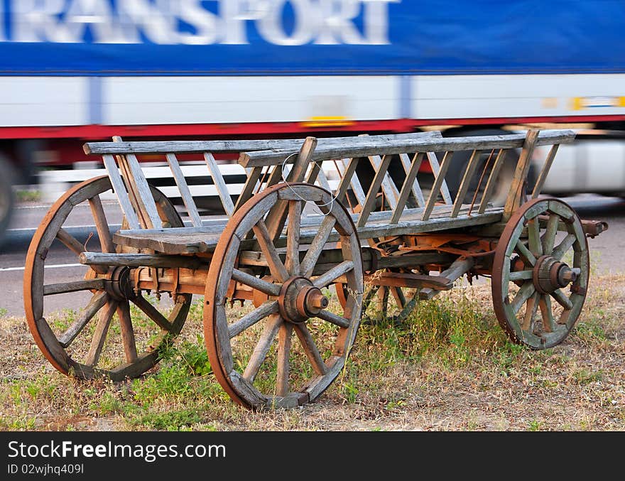 Old horse-drawn cart and newest truck. Old horse-drawn cart and newest truck