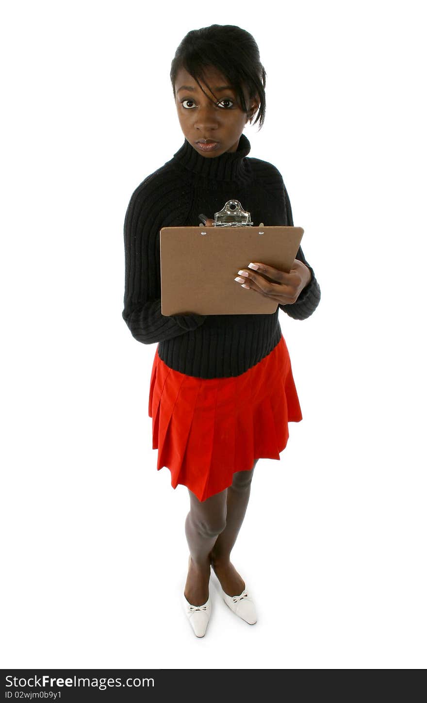 Attractive young african american woman in dress suit with clipboard. Writing on clipboard. Over white background. Attractive young african american woman in dress suit with clipboard. Writing on clipboard. Over white background.