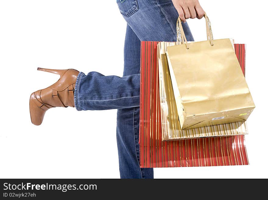 Sexy blond woman with shopping bags smiling happily