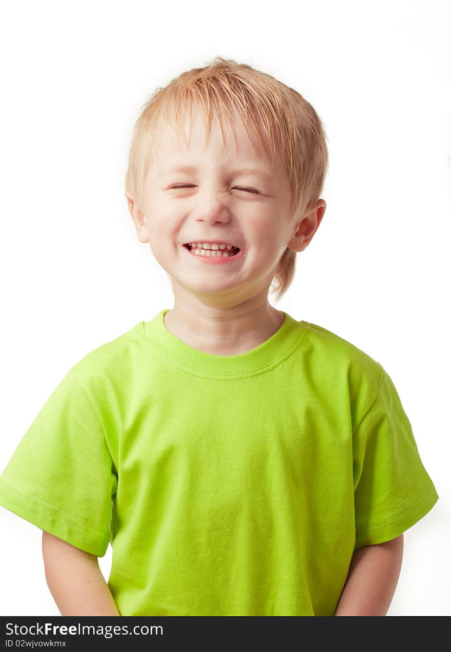 Boy smiling eyes closed, on a light background