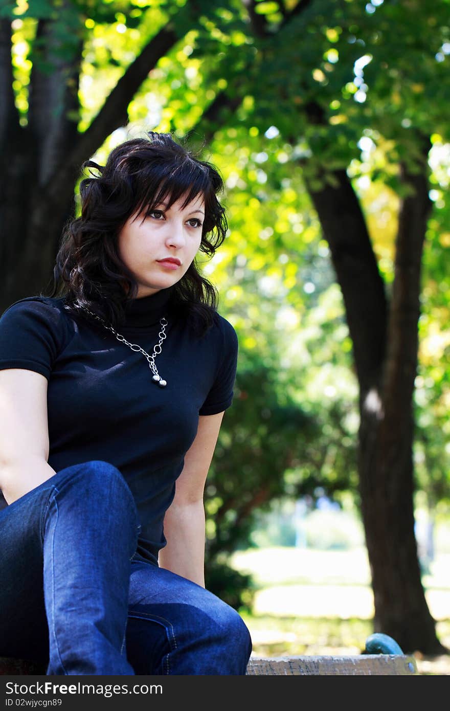 Young girl in the park to nature