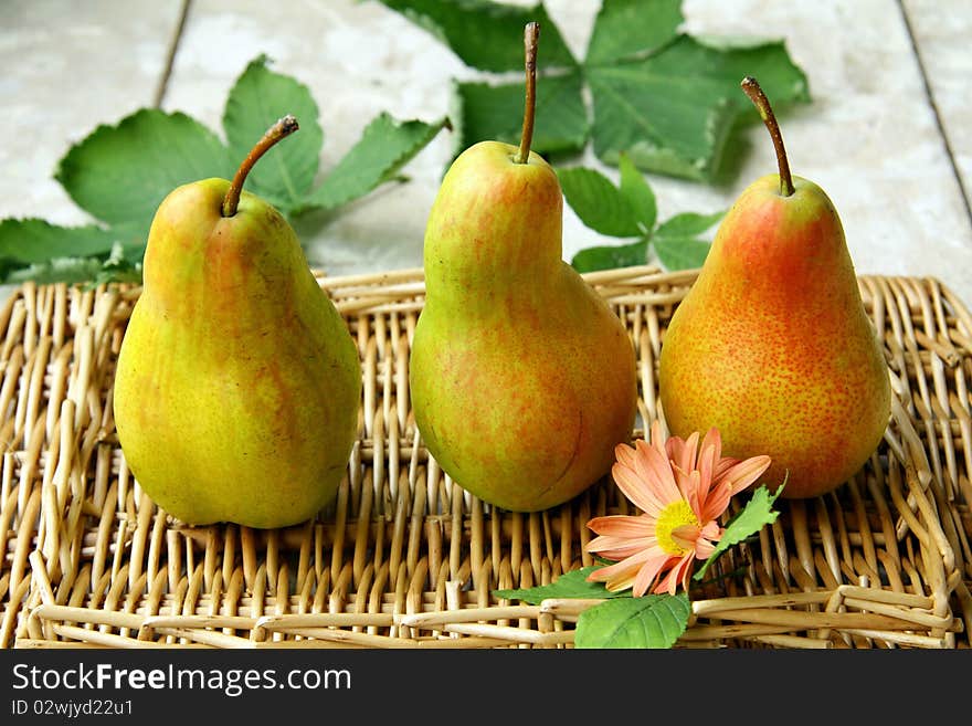 Beautiful ripe pears on a wooden table