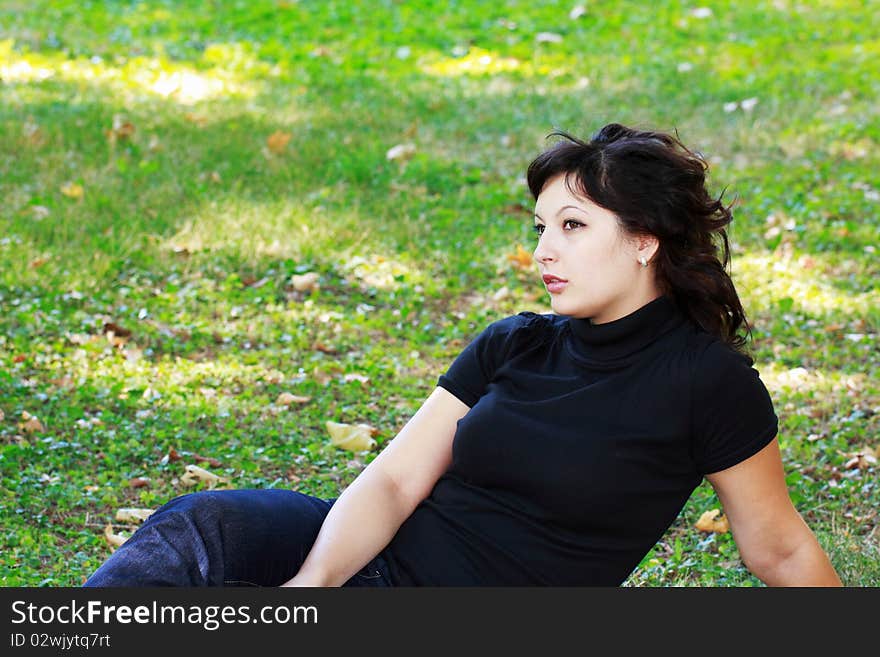 Young girl in the park to nature