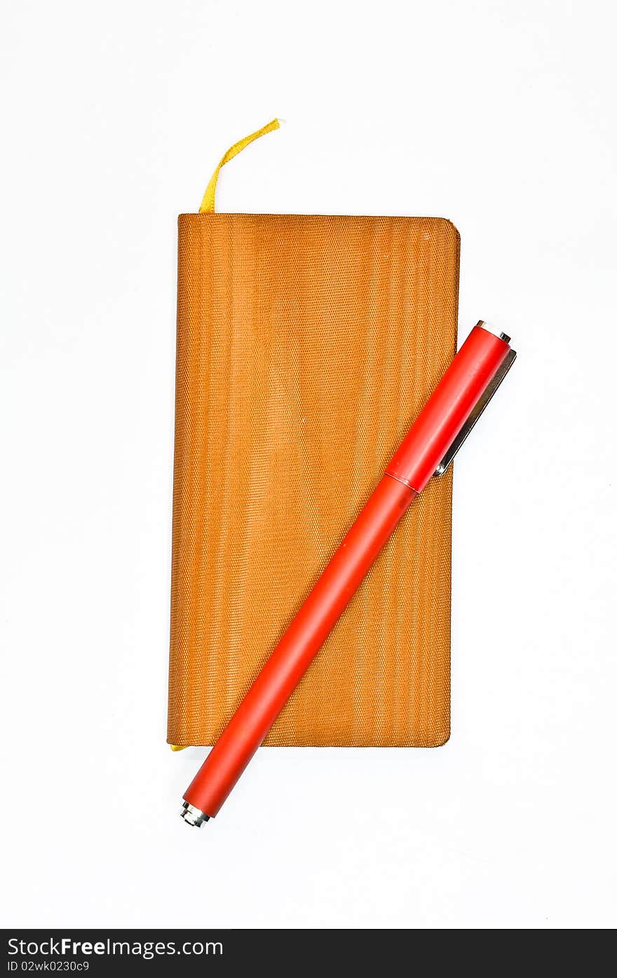 Diary book with a red pen on white background