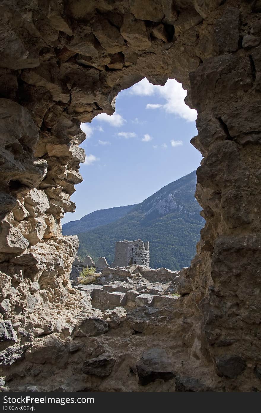 Chateau puilarens, one of the cathar castles in the midi pyrenees, france. Look through an arch. Chateau puilarens, one of the cathar castles in the midi pyrenees, france. Look through an arch.