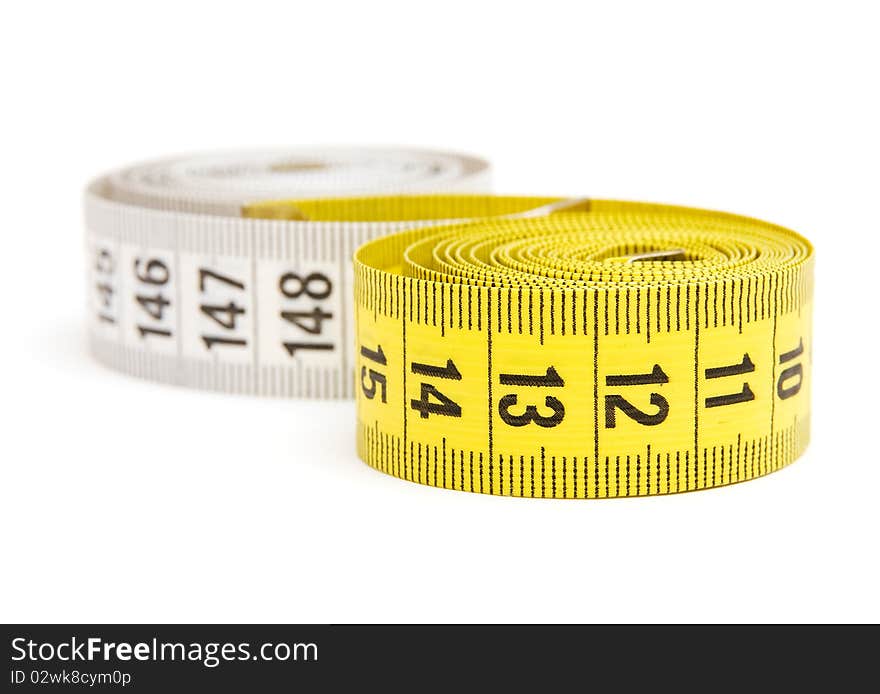 Yellow measuring tape isolated on white background. Yellow measuring tape isolated on white background