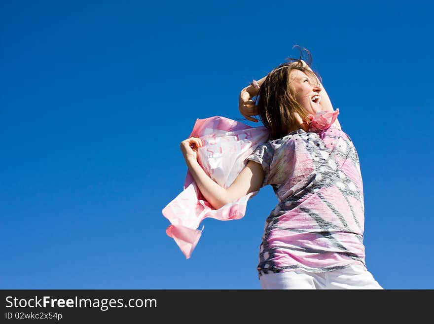 Happy Brunette Playing With A Scarf In The Summer