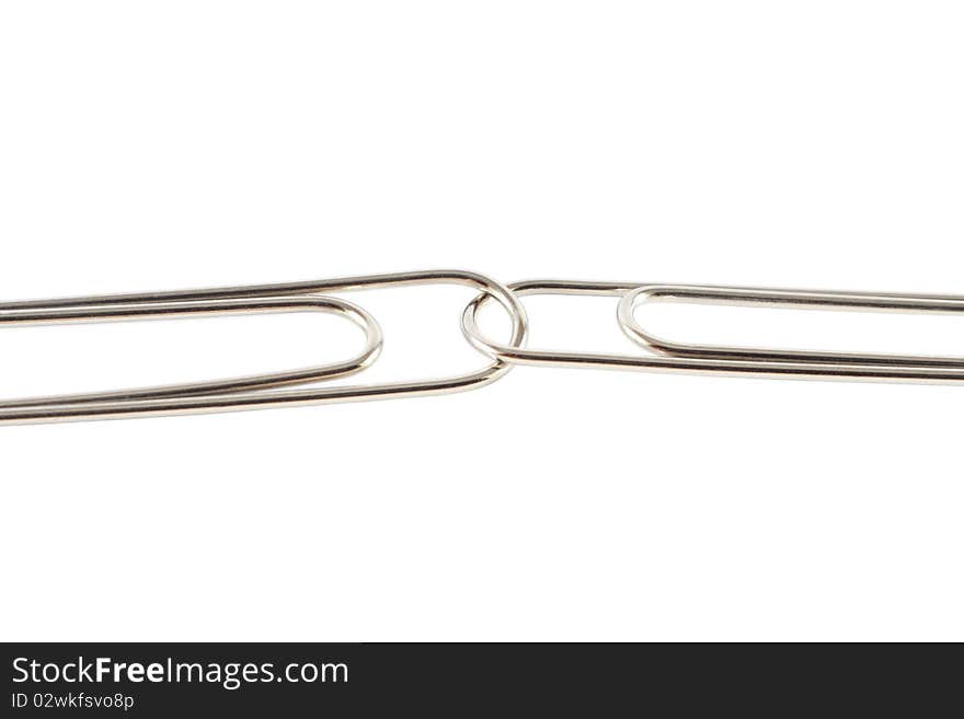 Two paperclips linked together, isolated. Two paperclips linked together, isolated.