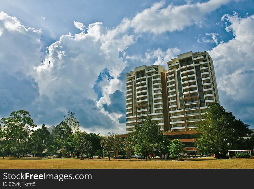 Two high-rise buildings against clouds and the sky. Two high-rise buildings against clouds and the sky.