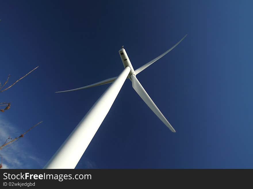 Bottom view of a wind turbine generating electricity. Bottom view of a wind turbine generating electricity.