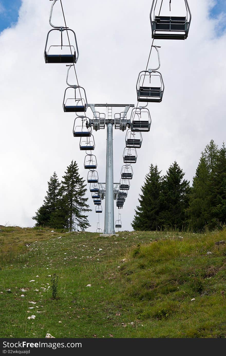 Skilift  in the mountains to ski on a green lawn during the summer