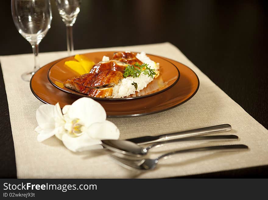 Restaurant serving with plate  and flower