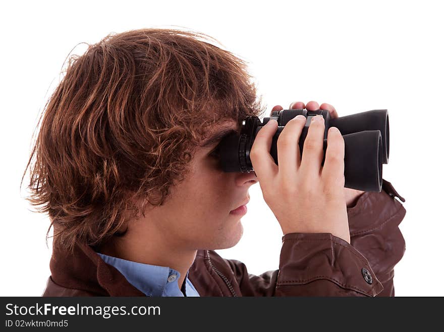 Young boy looking through binoculars