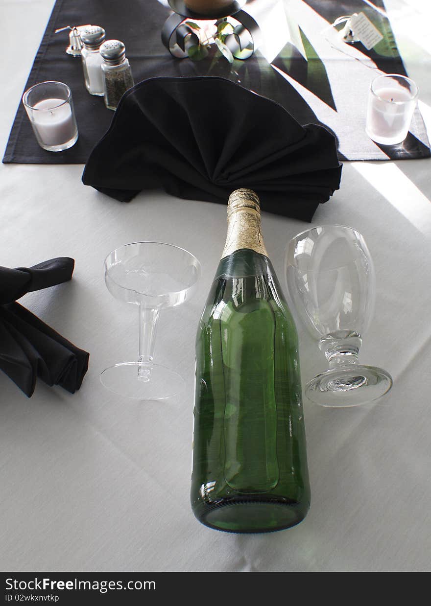 Champagne and glasses set out for guests at a wedding receptions