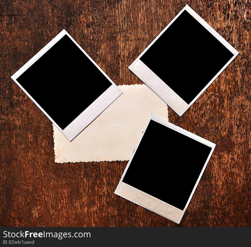 Vintage blank photo frame on wooden background