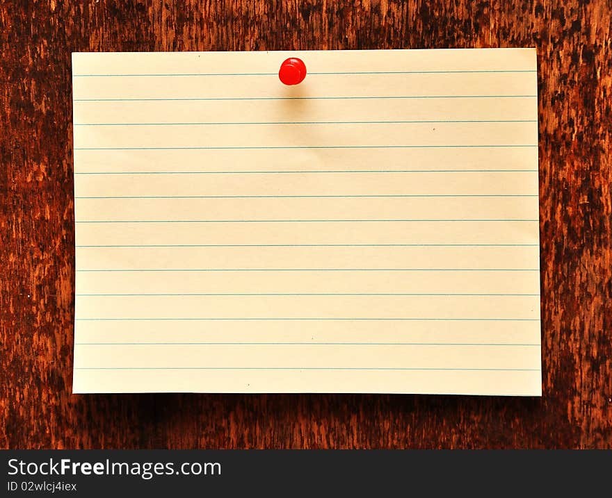 Blank adhesive note against old wood background